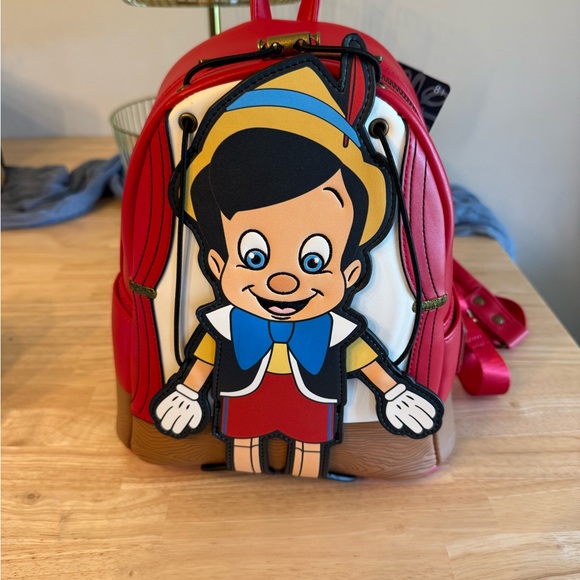 Disney Handbags - Disney Loungefly Pinocchio Backpack